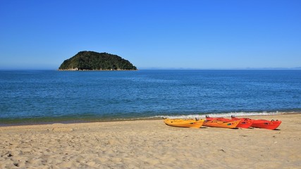 Kayaks at the beach and small island