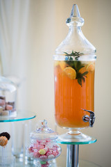 Fresh juice on wedding dessert table in restaurant