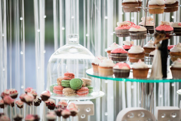Beautiful wedding dessert table in restaurant