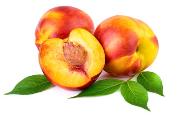 Nectarine organic fruits with leaves on white background.