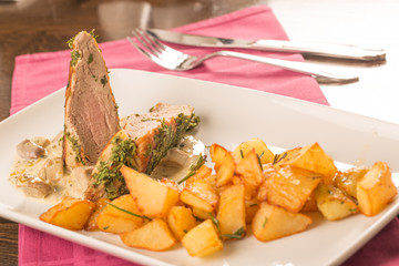 Pork tenderloin baked in crust  with potatoes