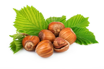Filbert nuts with leaves on white background