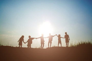 Silhouette Children playing on summer sunset happy time