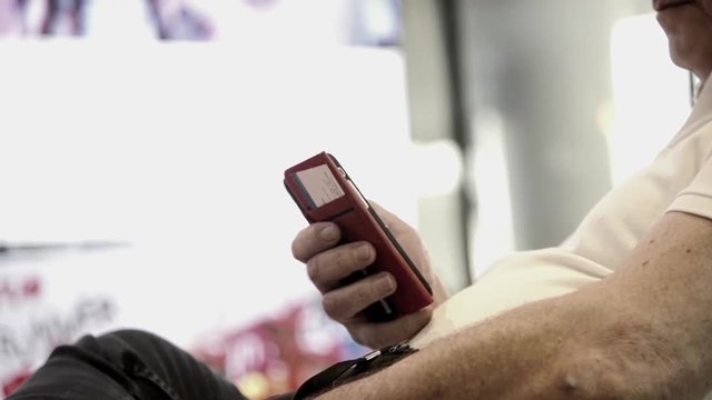 Unknown Old Fat western male use smartphone with touch screen to chat and contact people full HD