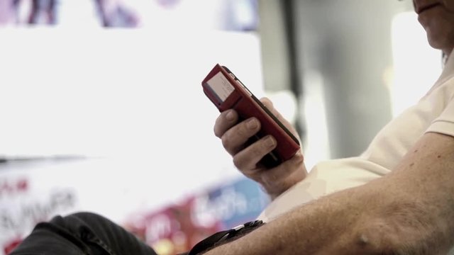 Unknown Old Fat western male use smartphone with touch screen to chat and contact people full HD