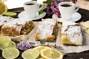 pie, strudel with pear and lemon. Cup of coffee. .Picnic, Breakfast in nature. Food in nature.