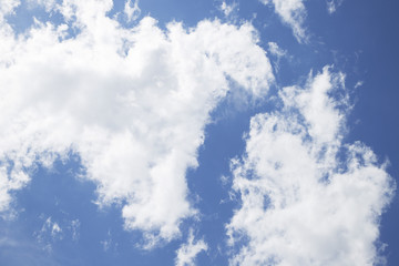 Bright blue sky with clouds closeup

