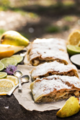 pie, strudel with pear and lemon. Cup of coffee. .Picnic, Breakfast in nature. Food in nature.