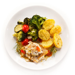 Fish dish - roasted fish fillets and vegetables 