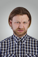 Obraz premium Young man grimace.