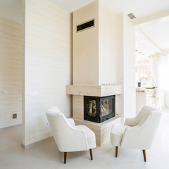 Modern fireplace in white, spacious living room