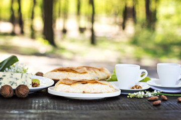 Сheese pie, strudel with cheese, cheese pie 4. Wine, grapes, nuts, cheese, blue cheese, and coffee. dinner, lunch, romantic date, picnic, eating on nature.
