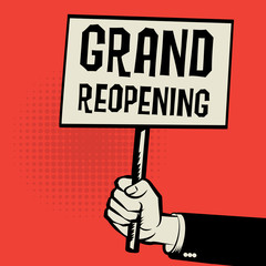 Poster in hand, business concept with text Grand Reopening