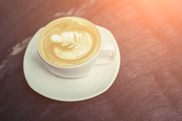 white cups of Cappuccino coffee with tree shaped milk foam.