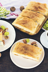 Сheese pie, strudel with cheese, cheese pie 4. Wine, grapes, nuts, cheese, blue cheese, and coffee. dinner, lunch, romantic date, picnic, eating on nature.