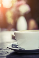 hot coffee with sunshine soft focus background