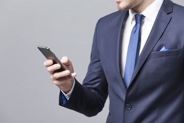 Businessman reading a message on the smart phone