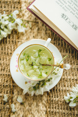 Acacia tea brewed in a cup is on the table