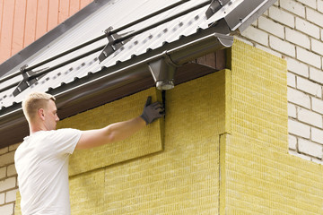 house insulation - insulating house facade with mineral rock woo