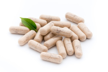 Ginkgo biloba capsule on the white background.