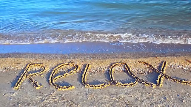 Inscription a relax on sand.