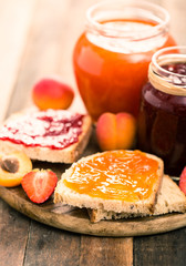 Strawberry and apricot jam on the bread