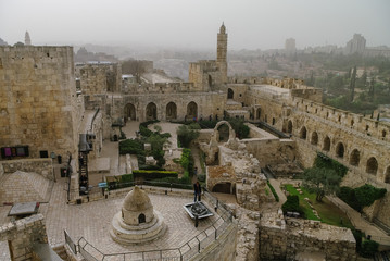 Jerusalem citadel and Tower of David with cityscape in sandstorm at background. Jerusalem, Israel