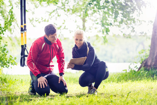 Man with personal trainer at debriefing