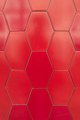Wall of red hexagon tiles


