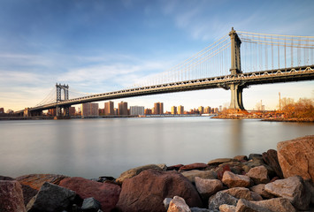 Manhattan Bridge over East River at sunset in New York City Manh