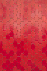 Wall of red hexagon tiles


