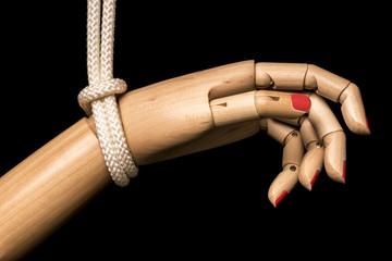 White woman hand attached with white rope