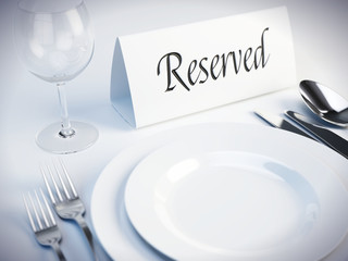 Reserved sign on a restaurant table - 3d render