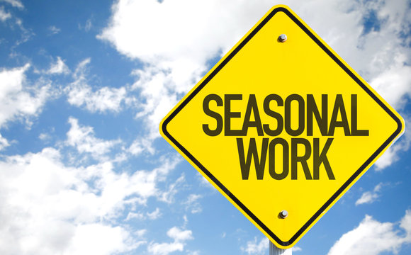 Seasonal Work Sign With Sky Background