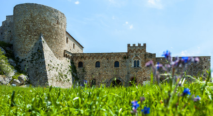 chart of the Bovino Castle, province of Foggia, seen with low angle to the level lawn in front....