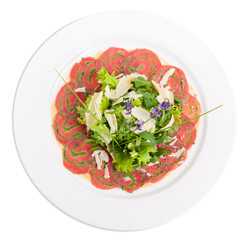 Veal carpaccio with fresh herbs and parmesan.