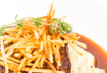 Delicious tenderloin steak with french fries.