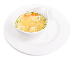 Chicken consomme soup with homemade noodles.