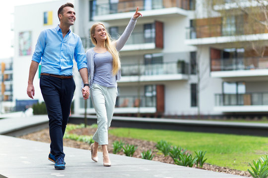 Young couple in modern residential area
