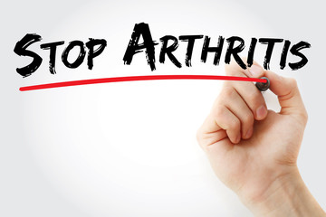 Hand writing Stop Arthritis with marker, health concept background