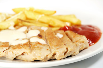 Fried pork / Fried pork and fried potatoes with ketchup on white plate.