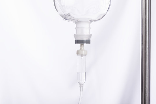 Close up saline IV drip for patient in hospital with copy space