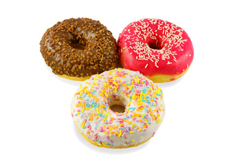Multi-colored donuts into the glaze