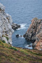 The cliffs of the Brittany in summer with fog