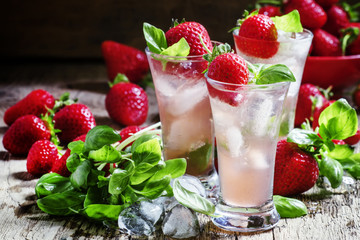 Alcoholic cocktail feeling with Cachaca, cranberry drink, strawb