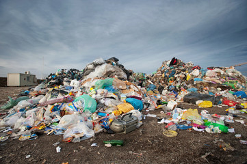Pile of waste at city landfill. Waste management, ecology concept