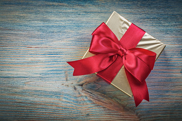 Wrapped present box on vintage wooden board top view holidays co