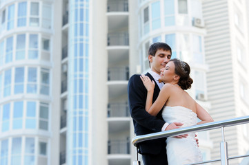 Bride and groom walking in the city