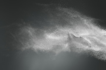 Abstract design of white powder cloud on dark background