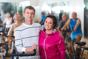 Fototapeta na wymiar man and woman posing in a gym and smiling